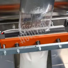 Автоматическая фасовочно-упаковочная машина HUALIAN DXDK-1000 NEW (пакет-подушка, ширина пленки 420 мм, фотодатчик) - 13