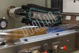 Горизонтальная упаковочная машина HUALIAN DXDZ-450B (3 servo, рег. форм., трансп., попереч. запайки) - 2
